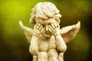 Weeping Angel Statue – Symbol of Negligence in Product Liability - Ferraro Law Firm statue of crying angel