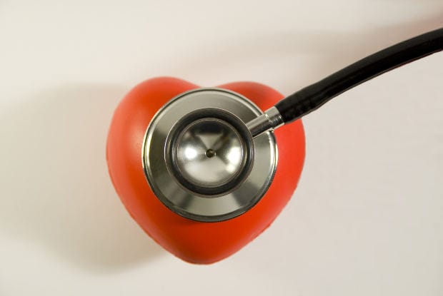 IVC Filter Safety Concerns After Injuries and Deaths - Ferraro Law Firm A stethoscope placed on a red heart, symbolizing medical risks linked to IVC blood clot filters and their safety concerns.