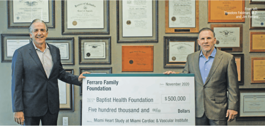 Ferraro Law Firm's founder Jim Ferraro giving 0,000 check to Baptist Health Foundation
